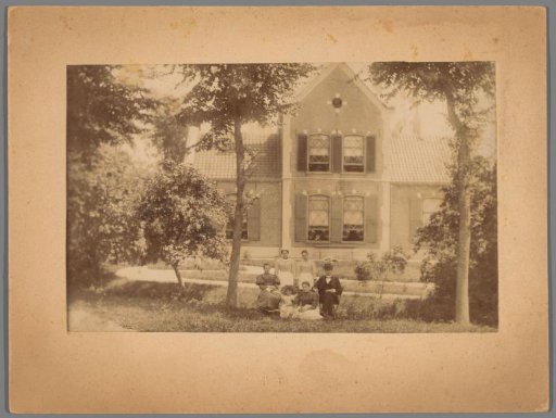 Family portrait of unknown people in a garden