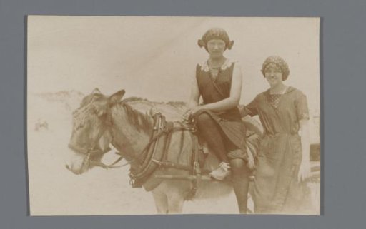 Portrait of Two Unknown Women Beside a Donkey on a Beach