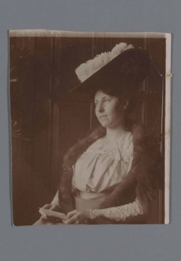 Portrait of an Unknown Woman with a Hat in an Interior