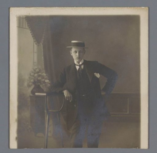 Portrait of an unknown young man with a straw hat