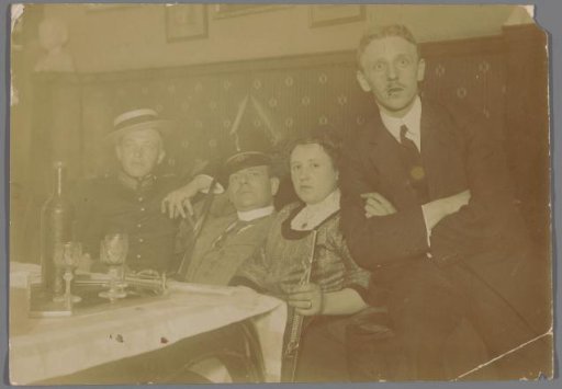 Group Portrait of Three Unknown Celebrating Young Men and a Woman, in Hotel Scheltema, Amsterdam
