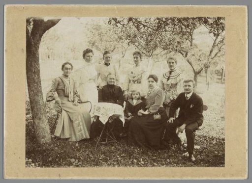 Family portrait of unknown people in a park