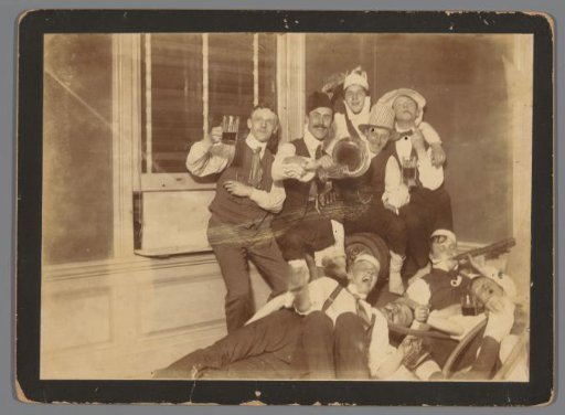 Group Portrait of Nine Unknown Celebrating Young Men, in Hotel Scheltema, Amsterdam
