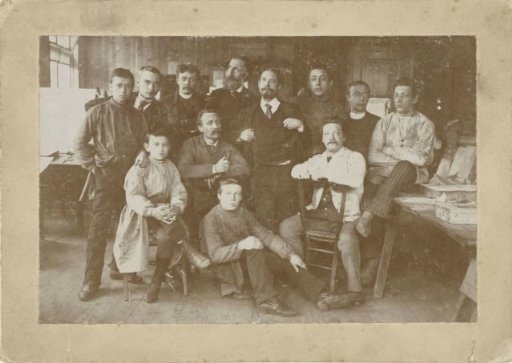 Group portrait of unknown employees of Senefelder Lithography with Christiaan J. Schuver on the back row right