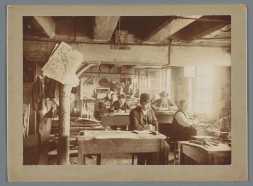 Group portrait of unknown employees of Senefelder Lithography at work