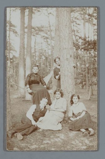 Group portrait of four unknown women and a man in a forest with a hammock