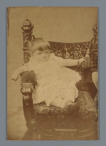 Portrait of a child on a chair
