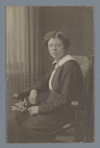 Portrait of an unknown woman seated on a chair