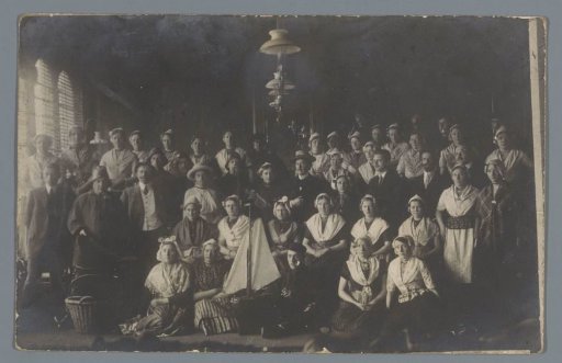 Group portrait of (presumably) a costumed theatre company before a performance