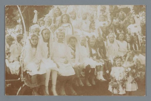 Group portrait of costumed girls (presumably) for a parade