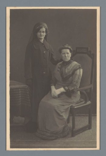 Studio portrait of an unknown woman and a woman in a nun's habit