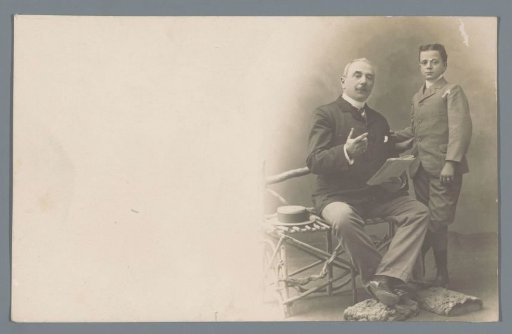 Studio portrait of an unknown old man and a boy