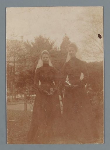 Portrait of two women in black dresses
