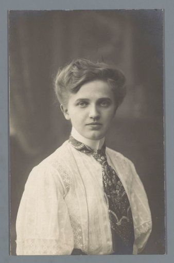 Portrait of an unknown young woman with a necktie