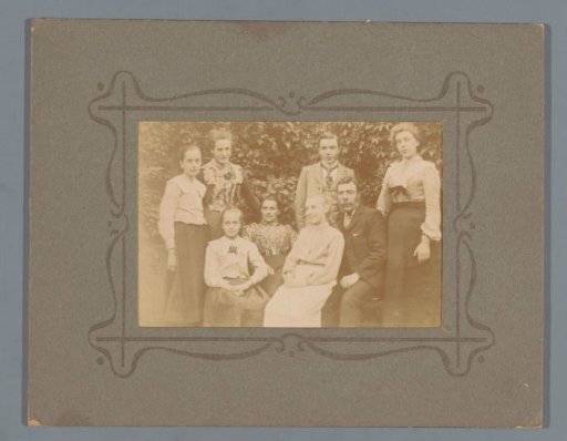 Group portrait of an unknown family in a garden