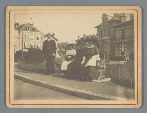 Group portrait of three unknown women on a bench and a standing man (possibly) in Biarritz