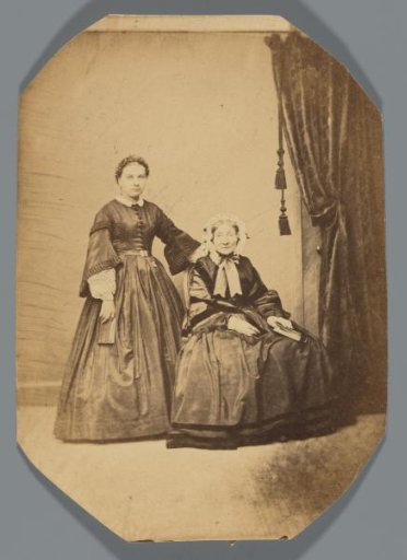 Portrait of two unknown women with a book in their hand