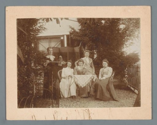 Group Portrait of Five Unknown Women with a Parrot in a Garden