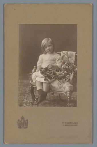 Portrait of Princess Juliana, seated on a chair with a bouquet of flowers