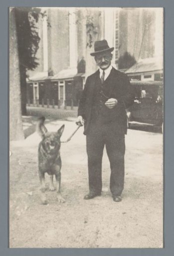 Portrait of an unknown man with a dog