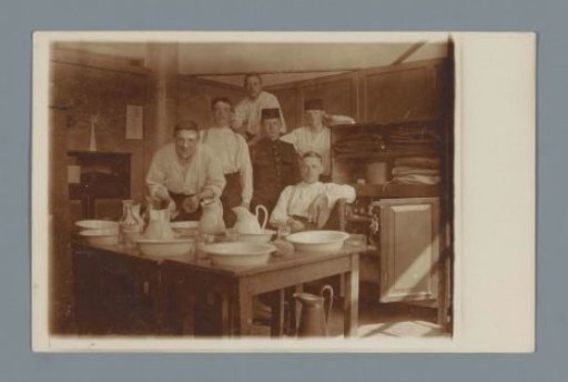 Group Portrait of Six (Presumably) Soldiers in an Interior with Washbasins and Ewers