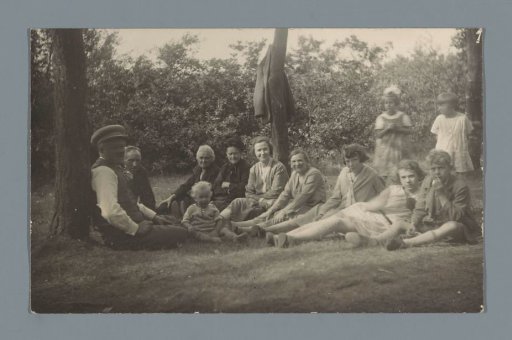 Seated company (presumably) in a forest