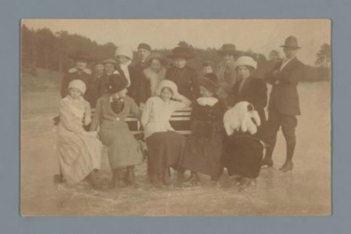 Group portrait of an unknown company skating on ice