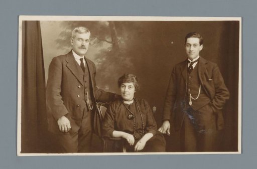 Studio portrait of an unknown married couple and their son
