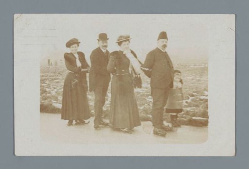 Portrait of an unknown company with a child on skates