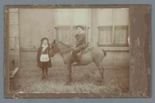 Girl and Boy on a Horse in Front of a House (Probably) in The Hague