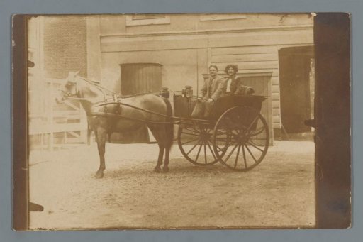 Portrait of an unknown man and woman in a horse-drawn carriage