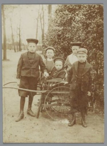 Group Portrait of Five Boys Around a Cart in a Park