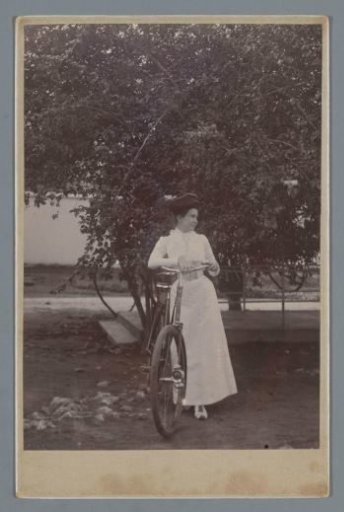 Portrait of an unknown woman with a bicycle