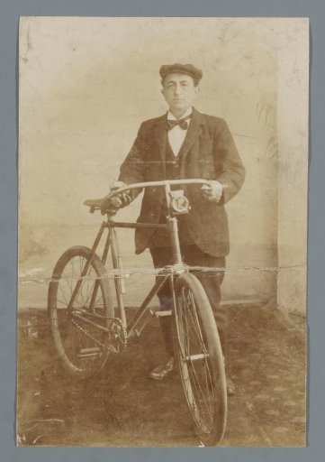Portrait of an unknown man with a bicycle