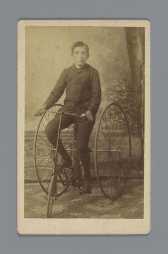Portrait of Matthieu van Oosterzee on a tricycle