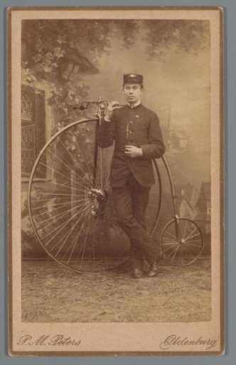 Portrait of an unknown man with a bicycle