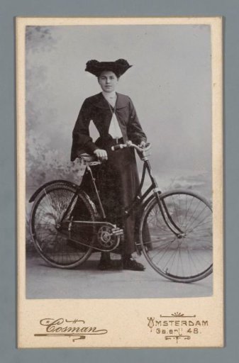 Portrait of an unknown woman with a bicycle