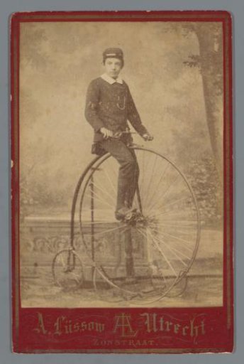 Portrait of Matthieu van Oosterzee on a bicycle