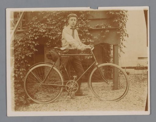 Portrait of an Unknown Boy (presumably) in Boy Scout Uniform with a Bicycle