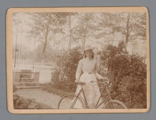 Portrait of an Unknown Woman with a Bicycle in a Garden