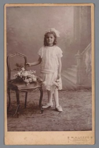 Portrait of an unknown girl in a white dress