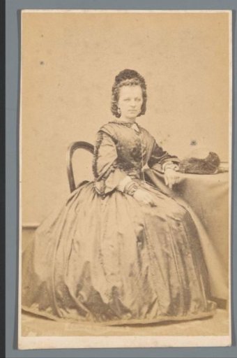 Portrait of an Unknown Woman, Sitting at a Table