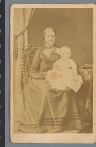 Portrait of an unknown woman with a child on her lap