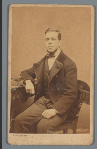 Portrait of an unknown man, seated at a table