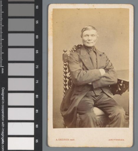 Portrait of an unknown man, seated with his arms folded at a table