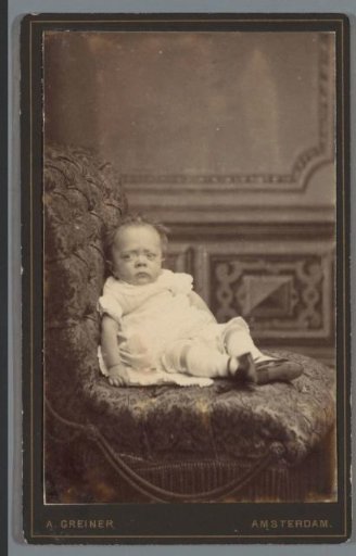 Portrait of an unknown infant on a chair