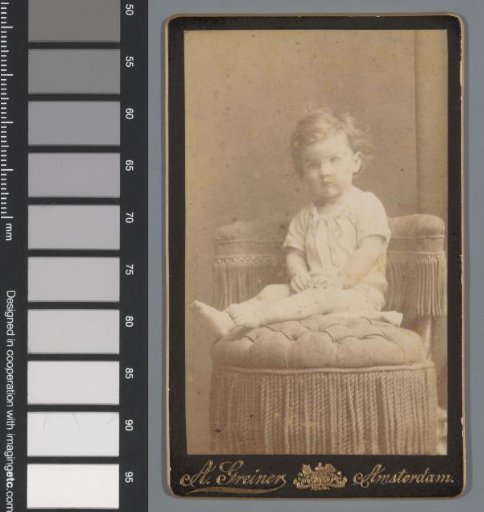 Portrait of an unknown child, seated on a chair