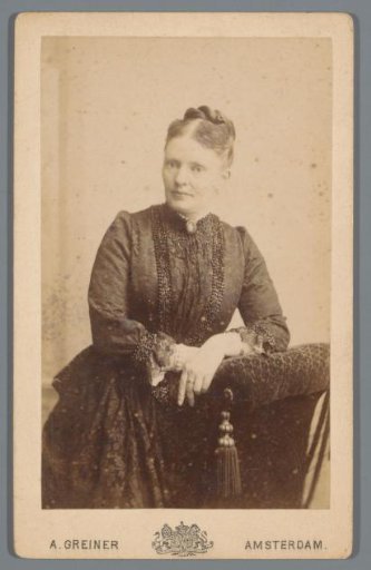 Portrait of an unknown woman, leaning on a chair