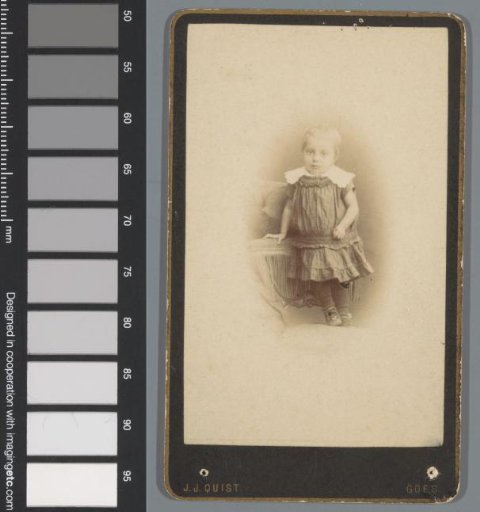 Portrait of an unknown girl, standing on a chair