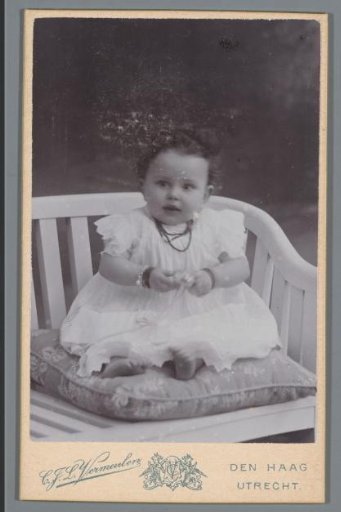 Portrait of an unknown baby on a chair
